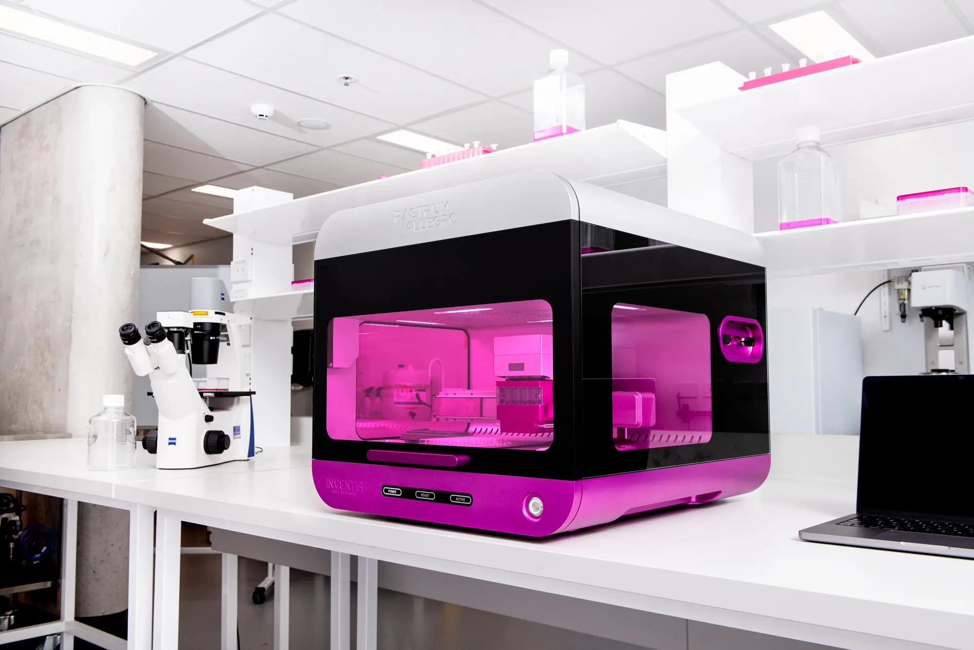RASTRUM™ Allegro on a laboratory bench with its front panel closed, highlighting its compact design for scalable, reproducible 3D cell culture in drug discovery and disease research.